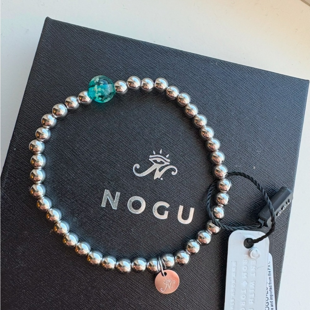 Nogu firefly glowing teal bracelet, new with tags